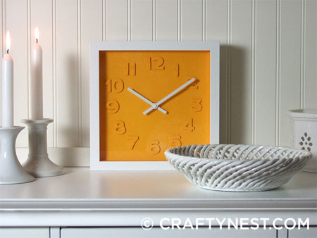 Colourful clock with embossed detail 