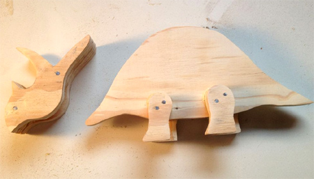Make wooden moveable dinosaurs 