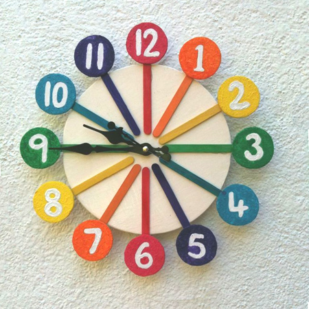Make a rainbow clock with recycled materials