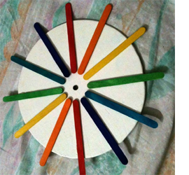 Make a rainbow clock with recycled materials 