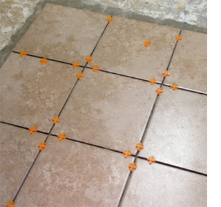 How to tile a kitchen floor lay tiles and insert tile spacers