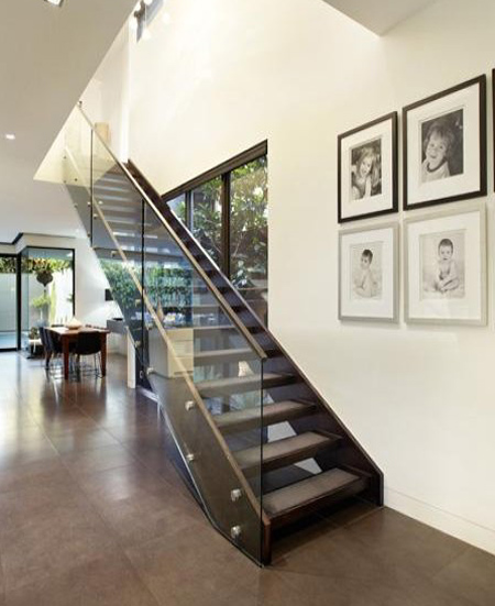 modern staircase with open glass panel side