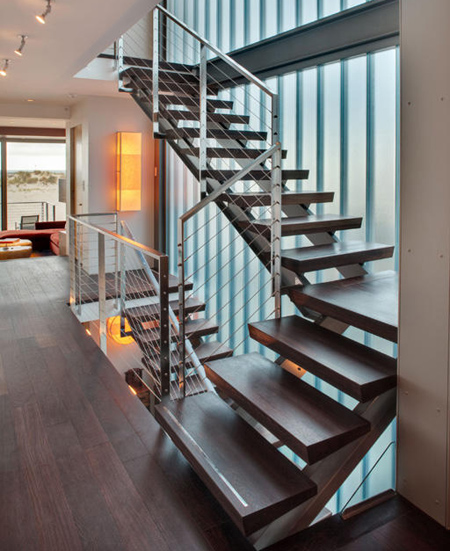 contemporary modern staircase with steel and wire sides