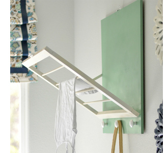 Design and organize a small laundry wall mounted clothes hanger