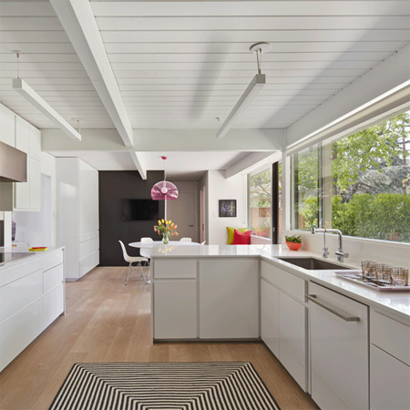 skylights and white painted panelling light bright home dark wood ceiling painted white