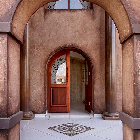 arched door with decorative glass panel