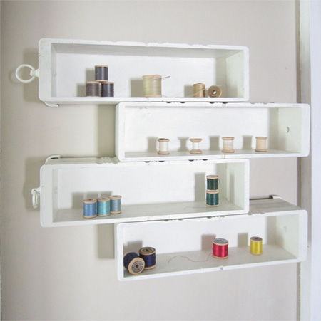 Repurpose an old drawer into storage shelves for craft or hobby room