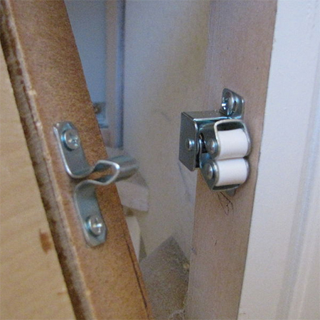 double roller catches mounted on frame of chest of drawers converted to bathroom vanity