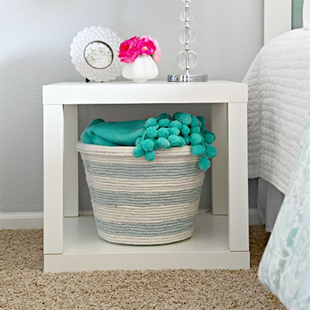 Turn plastic bins and cheap containers into attractive storage bins with rope