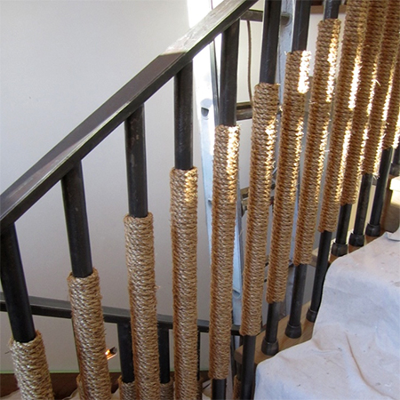 rope staircase railing bannister wrapped around steel bards