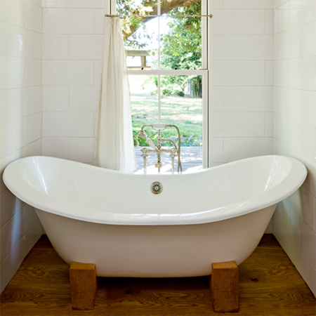 160 square metre house built from recycled and reclaimed materials salvaged bath tub