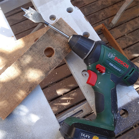 drill holes in the uprights for the reclaimed timber wood bird feeder