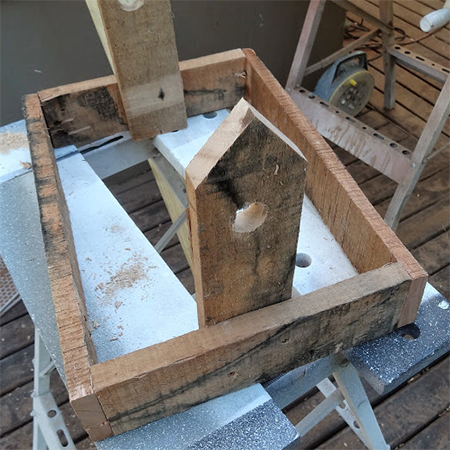 cut the uprights at a 45-degree angle for mounting the roof of the rustic bird feeder