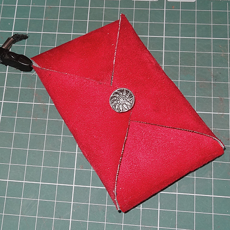 sew button to hold all three flaps in place on fabric, suede, pleather or leather cellphone holder
