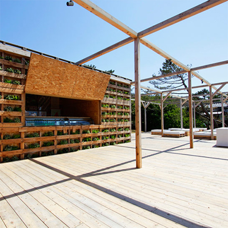 deck and beach bar constructed of reclaimed pallets 