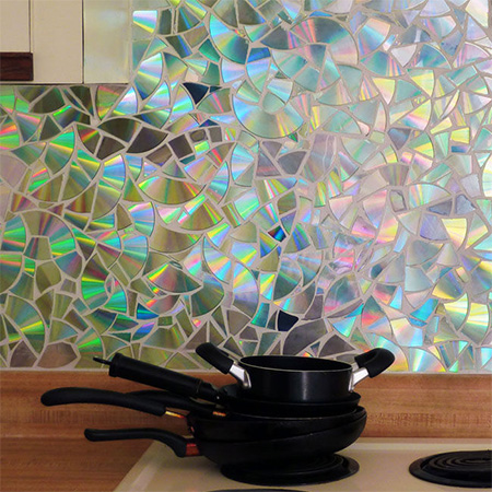 Recycle CD's into a gorgeous shimmering kitchen backsplash
