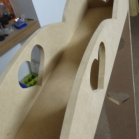 Assemble the shelf sections by screwing the sides onto the base.
