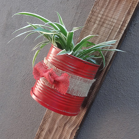 Recycled can plant holder with reclaimed wood