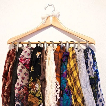 curtain rings on coat hanger for scarf rack for space saving closet ideas