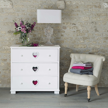 chest of drawers with heart cut out and distressed finish