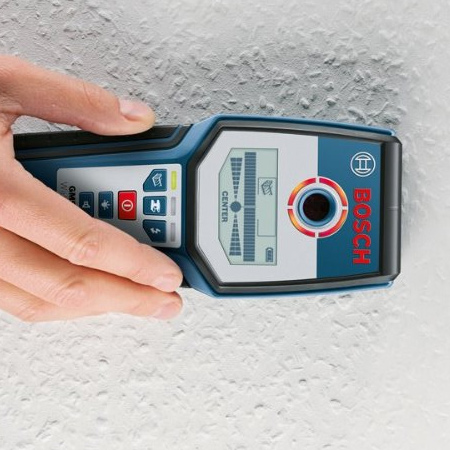 Before drilling any holes in solid ceilings, use an electronic detector to determine the positioning of conduits or electrical wires