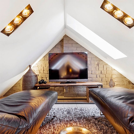 Attic conversion becomes spacious living space tv room