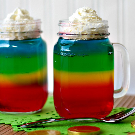 Rainbow jelly colourful party desserts and treats in mason jars