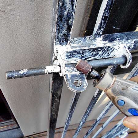dremel rotary multitool to remove paint on security gates and burglar bars
