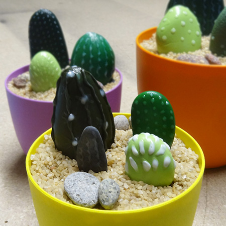 Paint pebbles for colourful cacti display