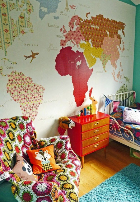 Wall maps have been trending for a couple of years now, and you can make your own feature wall map using paint and wallpaper or scrapbook papers. 
