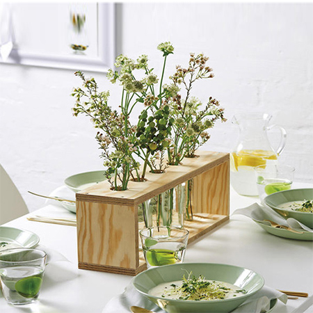 plywood flower stand with test tubes or plastic containers