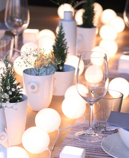 Ping pong balls are perfect for disguising LED string lights to create a wonderful, romantic table setting for a special occasion