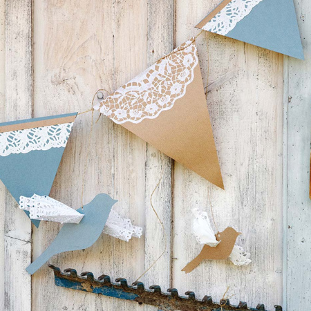 For a simple, decorative gardland cut out triangles to wrap over thin string and glue on a piece of lacy doily.  Browse the Internet for a bird template that you can cut out to add to your garland. Make a slit through the card to insert a folded doily for the wings and let your colourful garland take flight.