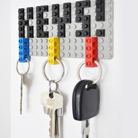 A lego plate and lego blocks can be put to use as a key hanger to store all your keys in one place.