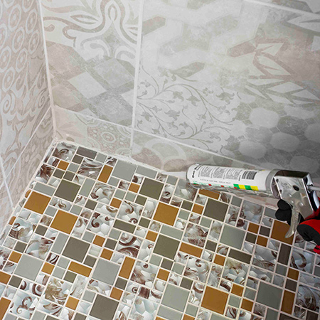 Install glass mosaics on shower floor