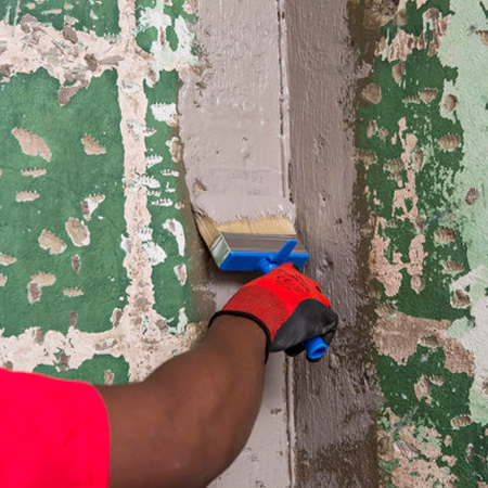 Apply the first coat of TAL Sureproof to the wall and floor corners. Immediately bed the TAL Sureproof Membrane (200mm wide) into the wet Sureproof