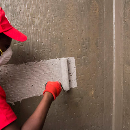 For the main shower wall and floor surfaces, apply the first coat of TAL Sureproof to the dry, primed surface with a short hair paint roller or brush, and allow approximately two hours to dry.