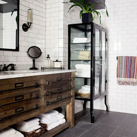 A vintage cabinet is transformed into a bathroom vanity