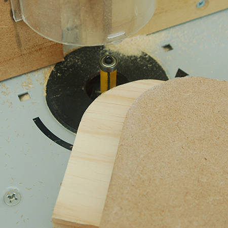 After cutting away excess wood or board, roll the router bit over for a smoothly rounded corner