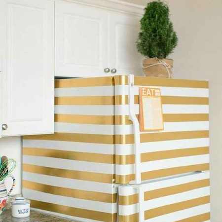 Refresh a refrigerator with gold stripes. Clean the surface with sugar soap, rinse and dry ad then use masking tape to mask off areas not being painted