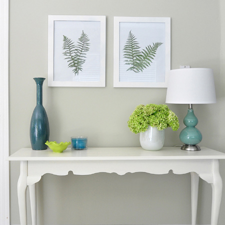 Bring a dash of nature indoors with a few fern fronds and inexpensive frames and add a unique feature to a plain wall.