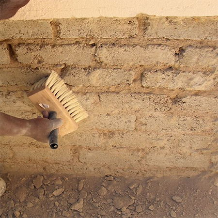 3. Use a 20mm masonry bit to drill holes two-thirds of the depth of the brick, into each brick immediately above the faulty damp proof-course. Use a brush to clean thoroughly, ensuring that no dust remains before moving on to the next step.