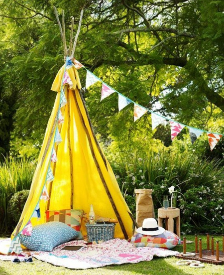 Or opt for a more basic outdoor structure using tree branches or dowels and some colourful fabric to make a teepee. You can even use PVC pipes to make an outdoor teepee.