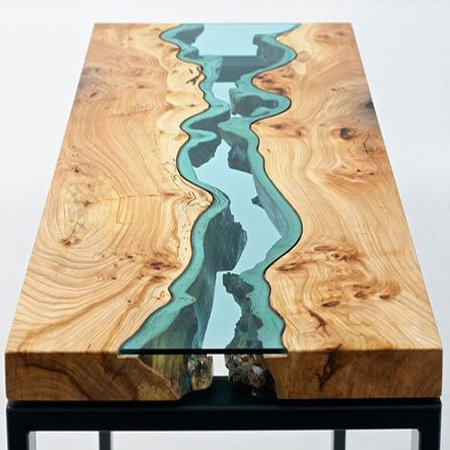 It is hard to decide whether Greg Klassen’s beautiful tables are furniture or art. Access to raw wood from a local sawmill allows Klassen to make use of its natural form and imperfections to craft his River Collection. These organic forms lend natural power to the 'rivers' and 'lakes' that form the basis for his design, all completed with coloured glass.
