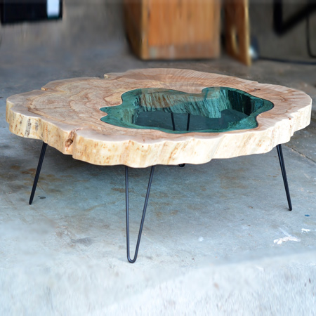 The 'Pond Table', another Greg Klassen creation, is given life by working with rough wood slabs and a variety of different tools to bring the material to finished form. Greg Klassen's work is created with a mix of traditional hand tools and modern machines.