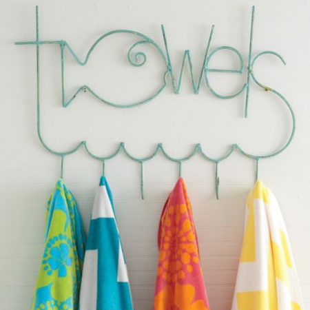 Rather than fitting towel rails, mount towel hooks to make it easier for children to hang up their towels