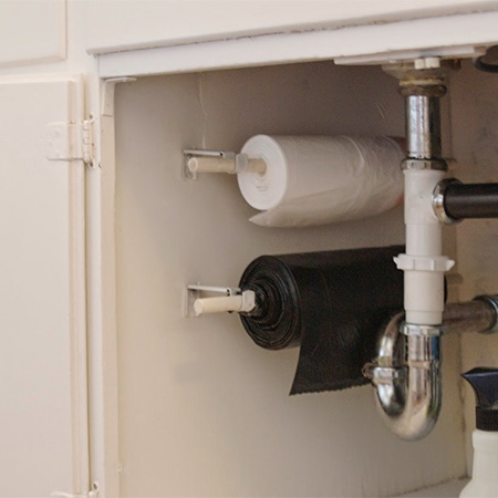 organise under a sink using a chrome or PVC rod and brackets to hang spray bottles