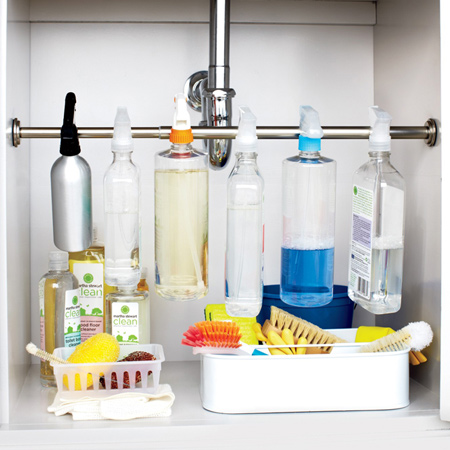  You can tidy up and organise this space using a chrome or PVC rod and brackets to hang spray bottles