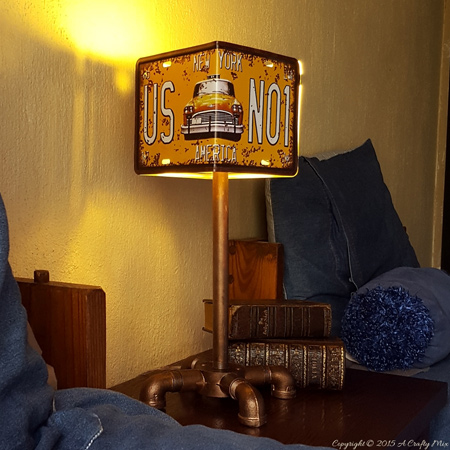 This vintage-style bedside lamp is made using mock licence plates, PVC fittings and galvanised pipe and accessories. What a wonderful finishing touch for a boy's bedroom.