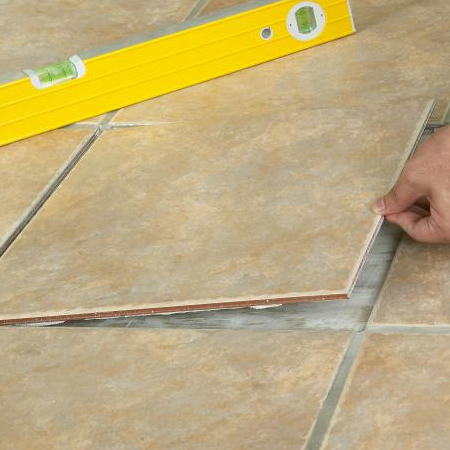 5. Mix tile adhesive according to the instructions and apply to the entire back of the replacement tile.